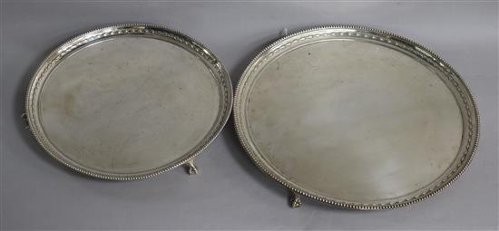 Two matching graduated silver salvers, 41oz gross